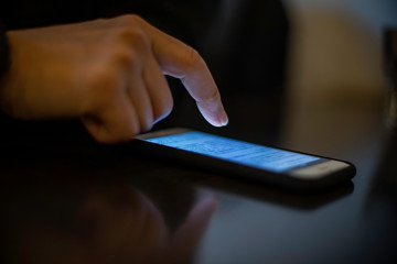 woman hand using a mobile phone