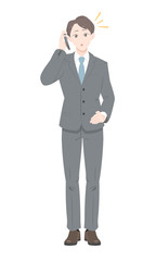 電話　驚き　ポーズ　ビジネス　スーツ　男性　全身