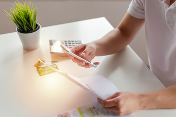 hand of young man using mobile smart phone for scan and payment online with family budget cost...