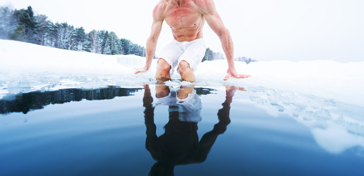 Young Athletic Man Going To Have Ice Bath In The Winter Pond