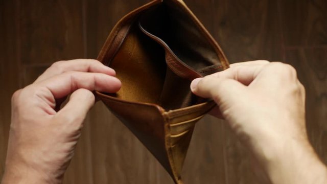Man bankrupt arrears showing empty wallet with no money. Poverty finance business bankruptcy concept. Male debt businessman showing empty wallet. Financial crisis of getting into debt. no money on