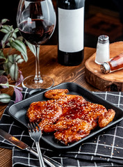 tabaka chicken under sauce with red wine