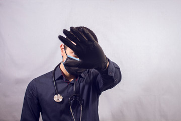 doctor makes stop sign with hands