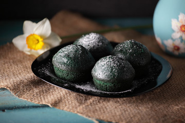 Fototapeta na wymiar sweet green muffins with spring flowers