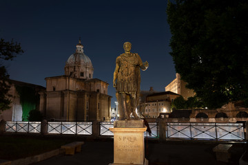 Fototapeta na wymiar Bronze replica statue of Gaius Julius Caesar, Imperial Forum, Rione Monti, Rome. Roman dictator, politician, military general, and historian. The first of the twelve Caesars.