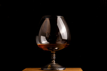 Cognac glass isolated on black background
