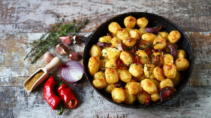 Baked potatoes in a pan. Cooking at home. Appetizing potatoes.