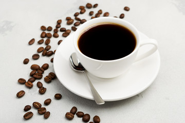 cup of black coffee on a light background