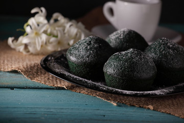 Fototapeta na wymiar sweet green muffins with spring flowers