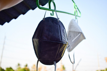 face mask hanging for reuse with sky background 