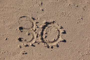 30 written on beach sand
