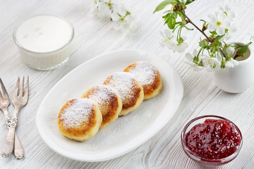 Cheese pancake - cottage pancakes, strawberry jam, sour cream