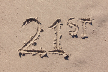 twenty first written in beach sand