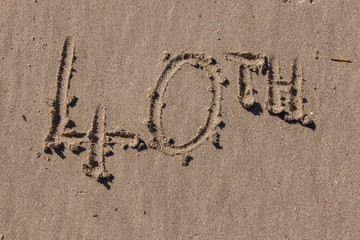 fortieth written in beach sand