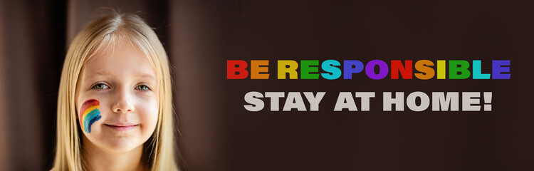 Girl with painted rainbow on face during Covid-19 quarantine at home. Stay at home Social media...