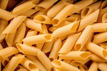 italian penne pasta, closeup on detail, culinary background
