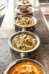 traditional Indian dishes standing in the restaurant