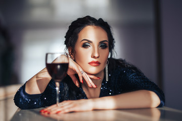 portrait of sexy mature women in black suit. very strong and serious