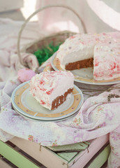 Slice of strawberry cake. Pastel pink decoration. Homemade cake. 