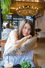 Beautiful Asia business woman over blured cafe background.