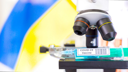 Fototapeta na wymiar The vaccine for Covid-19 or coronavirus on the microscope