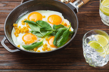 Fried eggs for breakfast close-up. Wooden table. Healthy eating