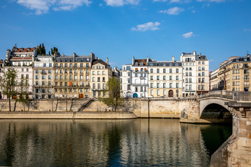 Obraz na płótnie Canvas Paris, France - April 9, 2020: Typical Haussmannian buildings on the Ile Saint Louis during containment measures due to covid-19