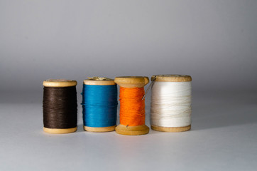 reels with thread and needle