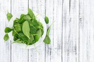 Portion of fresh Spinach (close-up shot)