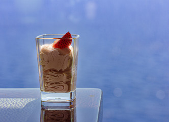 Berry mousse in a small glass. Sweets. Strawberry Mousse.