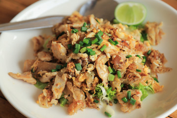 Thai food dish meal  noodle stir fried with pork served with lime for  spicy 