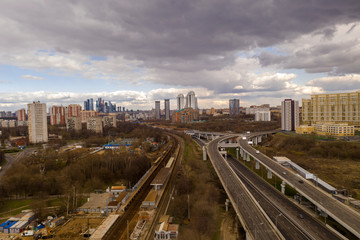 Fototapeta na wymiar fantastic clouds over a frozen city isolated from a drone