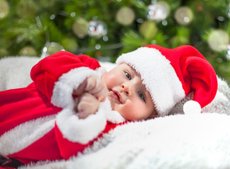 Fototapeta na wymiar baby santa claus dress for christmas