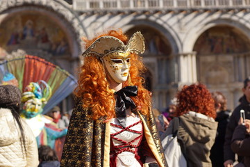 Fototapeta na wymiar VENICE / ITALY - February 6 2016: Carnival performers participate this event in Piazza San Marco in Venice, Italy. The tradition began in 1162 to celebrate the defeated Ulrico, Patriarch of Aquileia
