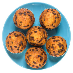 Muffins with chocolate chips on a ceramic plate