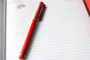 Pen on open notebook. Open diary page. Love letter concept.