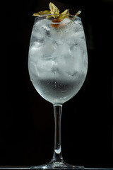 delicious cocktail with ice in a transparent glass