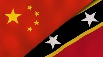 The flags of China and Saint Kitts and Nevis. News, reportage, business background. 3d illustration