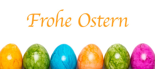 Border of easter eggs in different colors with text Happy Easter in German on white background