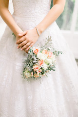 Bride's flower, white flowers and silk ribbon. Couple shoot on wedding day.