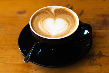 Top view a cup Late art coffee draw heart sharp