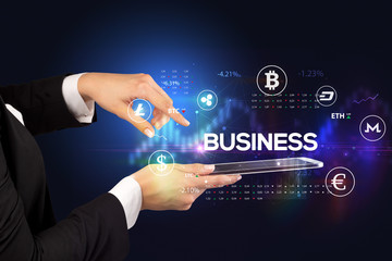 Close-up of a touchscreen with BUSINESS inscription, business opportunity concept
