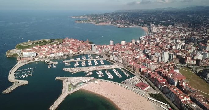 Panoramic aerial view of Gijon on Atlantic ocean coast overlooking of marina with moored pleasure yachts, Spain