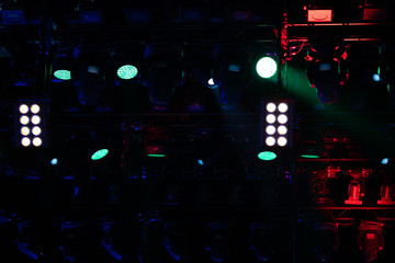 stage light with colored spotlights and smoke, concert scene 