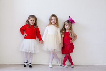 Kids friends for a birthday in the interior of the white room