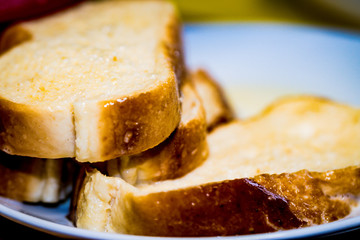 Putting bread with milk to make a typical Spanish food, torrijas.