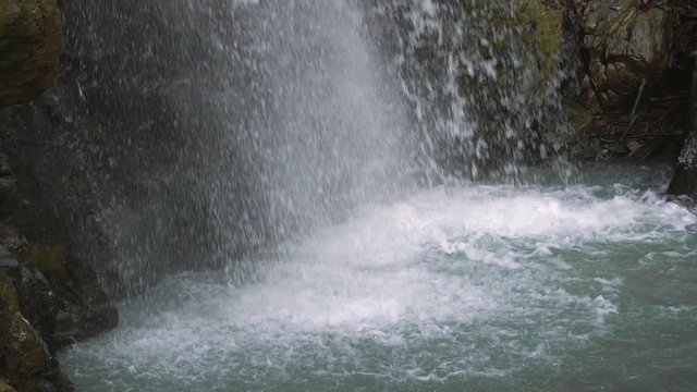 Motion Blur Waterfalls Peaceful Nature Landscape in Mountains. Waterfall at small river near Rosa Khutor resort in Caucasus mountains.