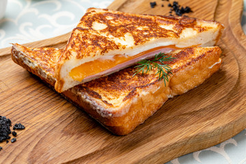 ham and cheese sandwich on the board
