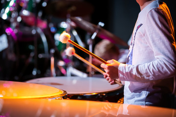 Young drummer in orchestra - B&W