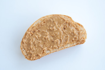 Toast with peanut pasta isolated on white background